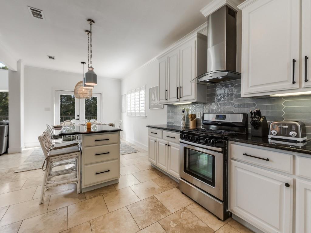 5848 Lago Vista Athens, TX 75752 - Photo 8 of 33 a kitchen with stainless steel appliances granite countertop a stove and a sink