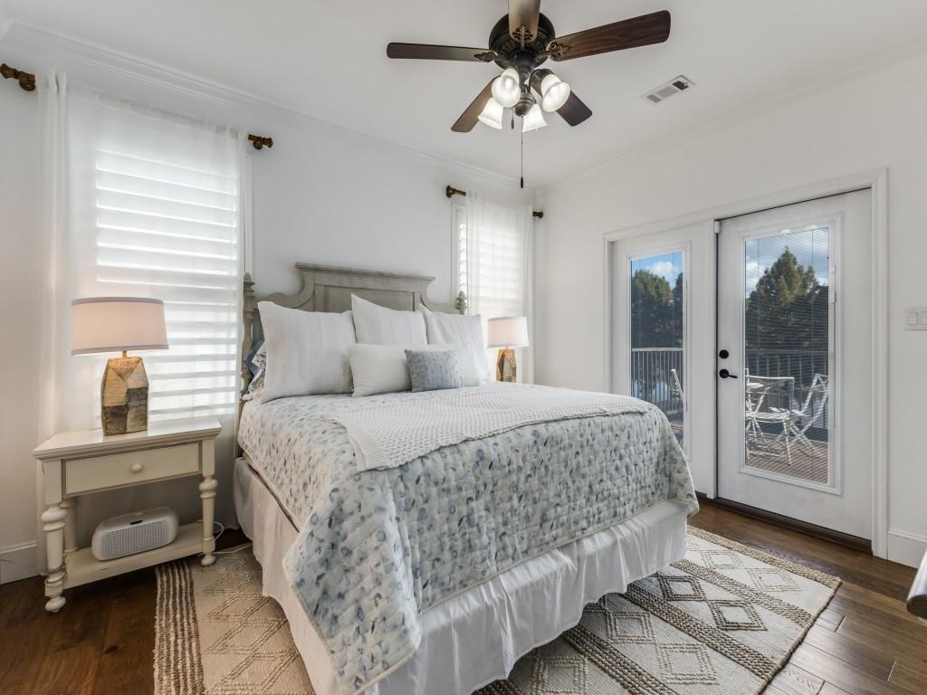 5848 Lago Vista Athens, TX 75752 - Photo 10 of 33 a bedroom with a large bed and a chandelier