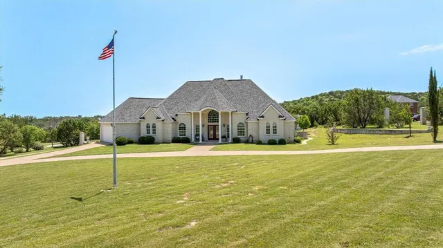 a house view with swimming pool