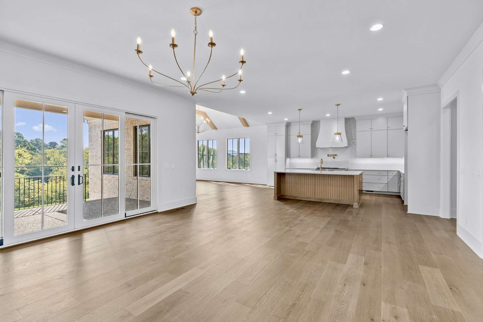 9917 Elland Road Brentwood, TN 37027 - Photo 17 of 99 a view of a kitchen with a stove wooden cabinets and a fireplace