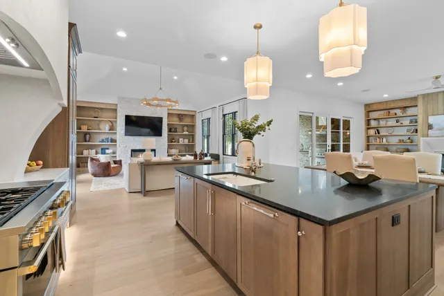 a room with a cabinets and chandelier