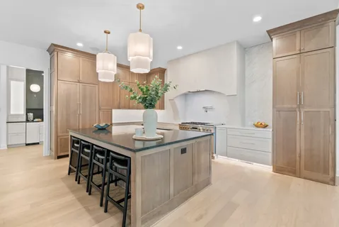 a bathroom with a toilet sink and shower