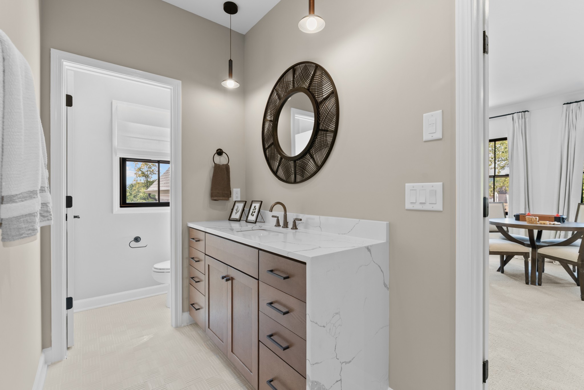9917 Elland Road Brentwood, TN 37027 - Photo 87 of 99 a bathroom with a toilet a sink and a mirror