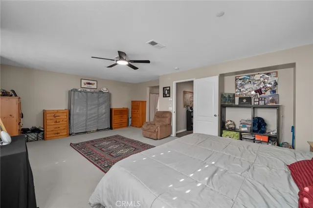 a bedroom with a bed and closet