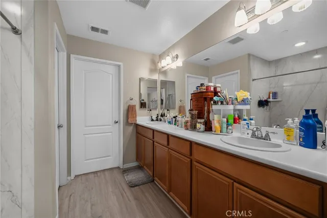 a utility room with sink dryer and washer