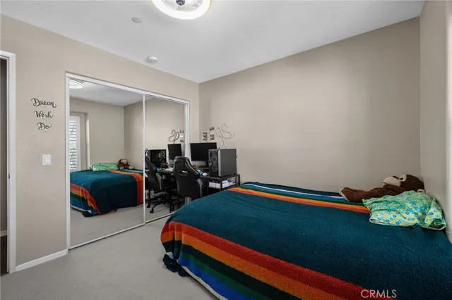 a bedroom with bed and a window