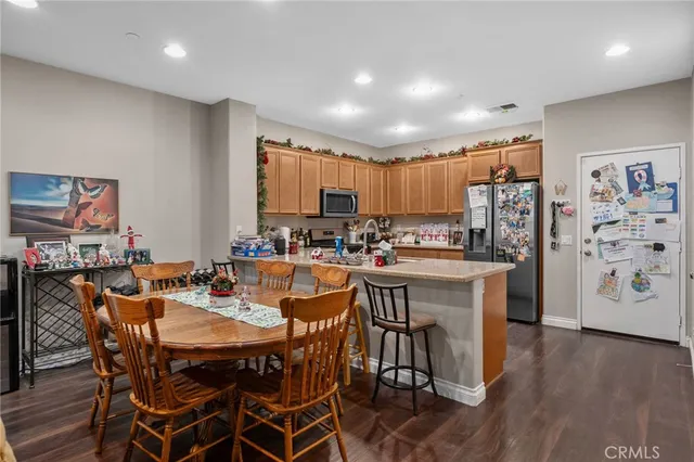 a kitchen with a table and chairs