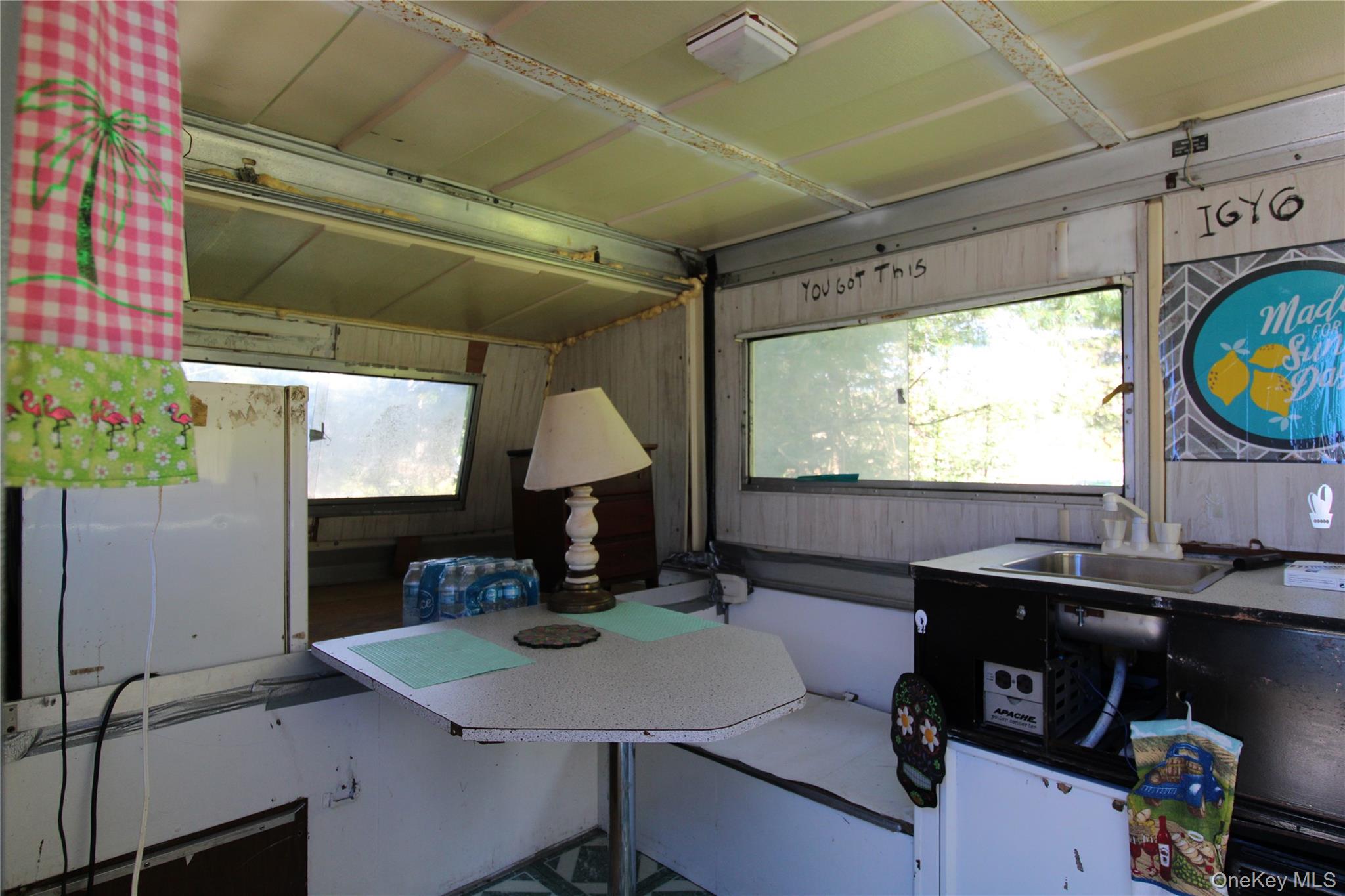 834 Cooley Road Parksville, NY 12768 - Photo 13 of 28 a living room with furniture and a flat screen tv