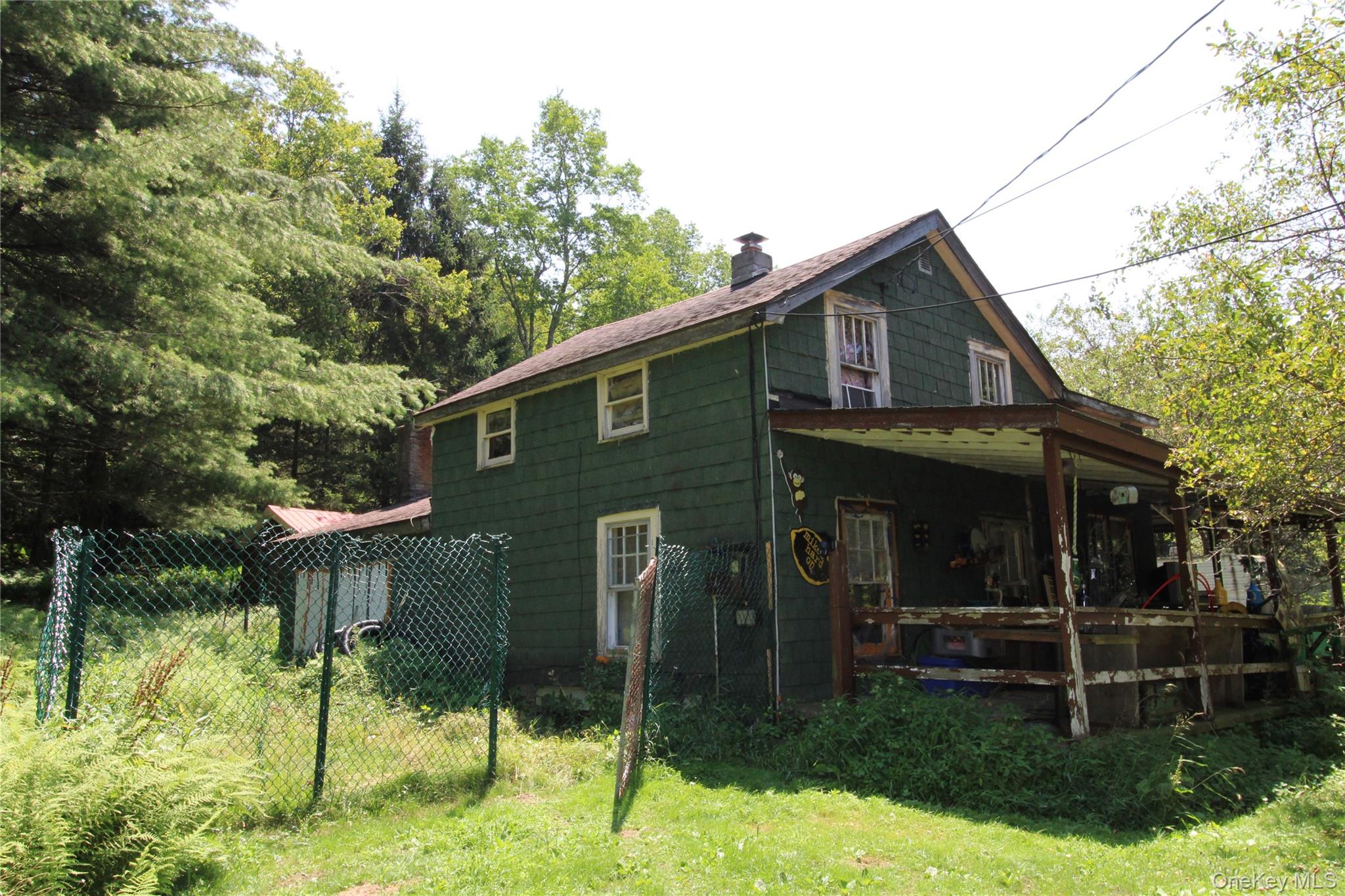 834 Cooley Road Parksville, NY 12768 - Photo 5 of 28 a front view of a house with a yard
