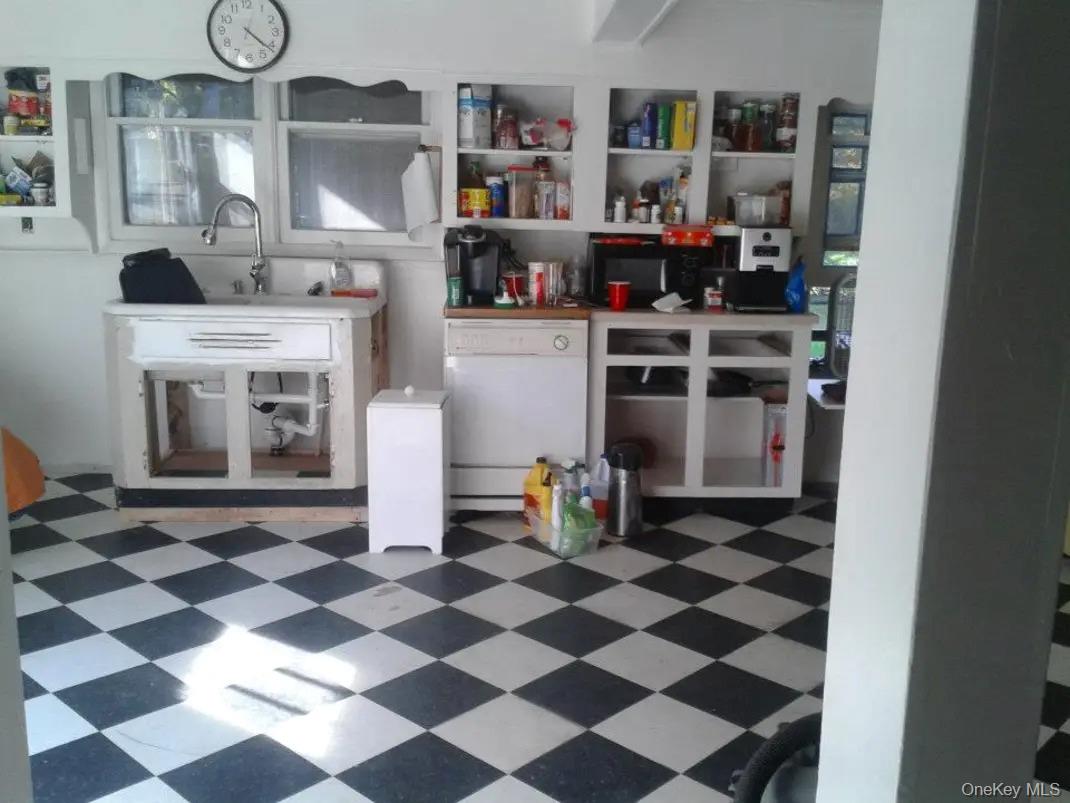 834 Cooley Road Parksville, NY 12768 - Photo 6 of 28 a kitchen with stainless steel appliances and cabinets