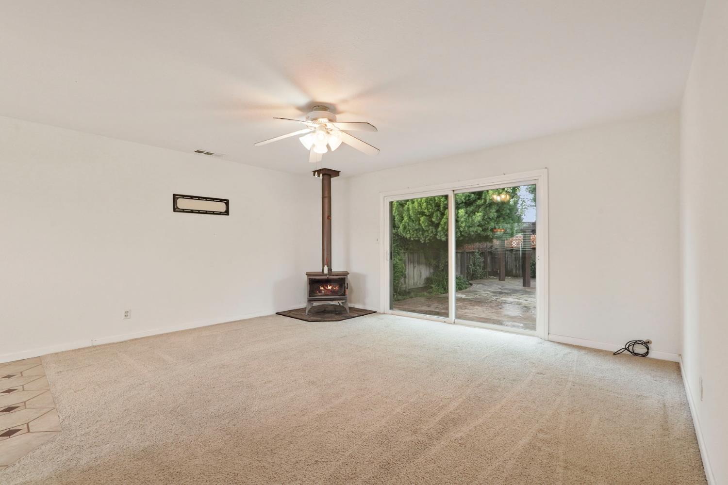1007 Cardinal Street Lodi, CA 95240 - Photo 5 of 31 a view of an empty room with a window