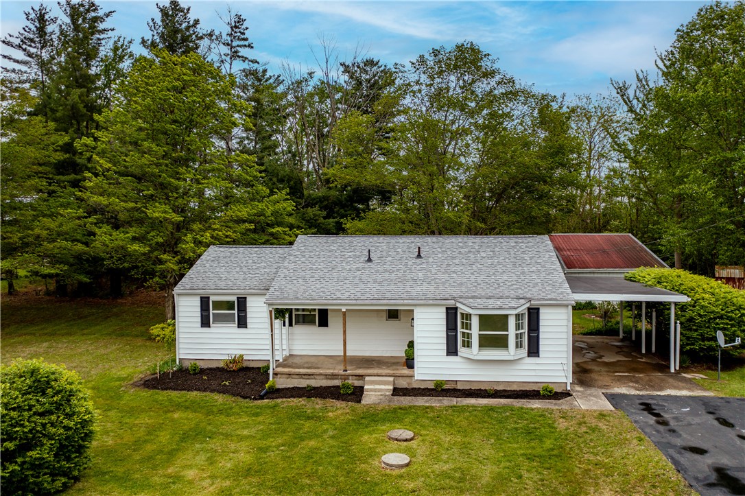 11296 Pansing Road Brookville, OH 45309 - Photo 48 of 53 This charming residence offers comfortable living amidst a serene, green landscape.