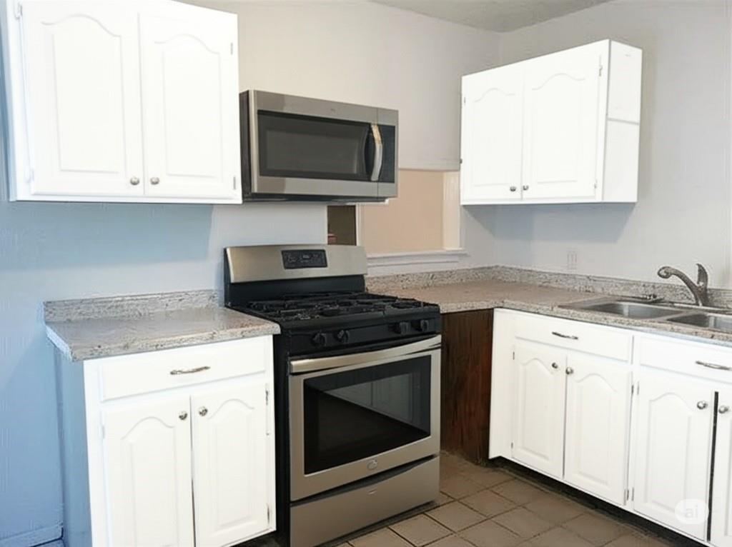 511 Rogers Road Newark, TX 76071 - Photo 11 of 19 Kitchen with stainless steel appliances, white cabinets, and light tile patterned floors