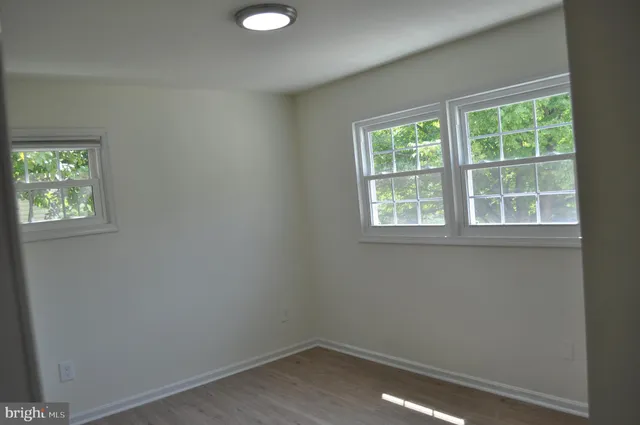 an empty room that has a window