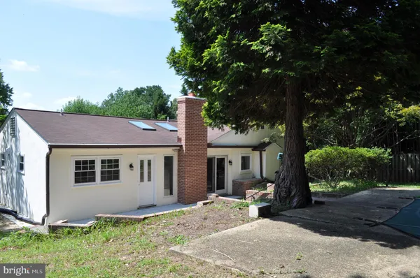 a house with a tree in front of it