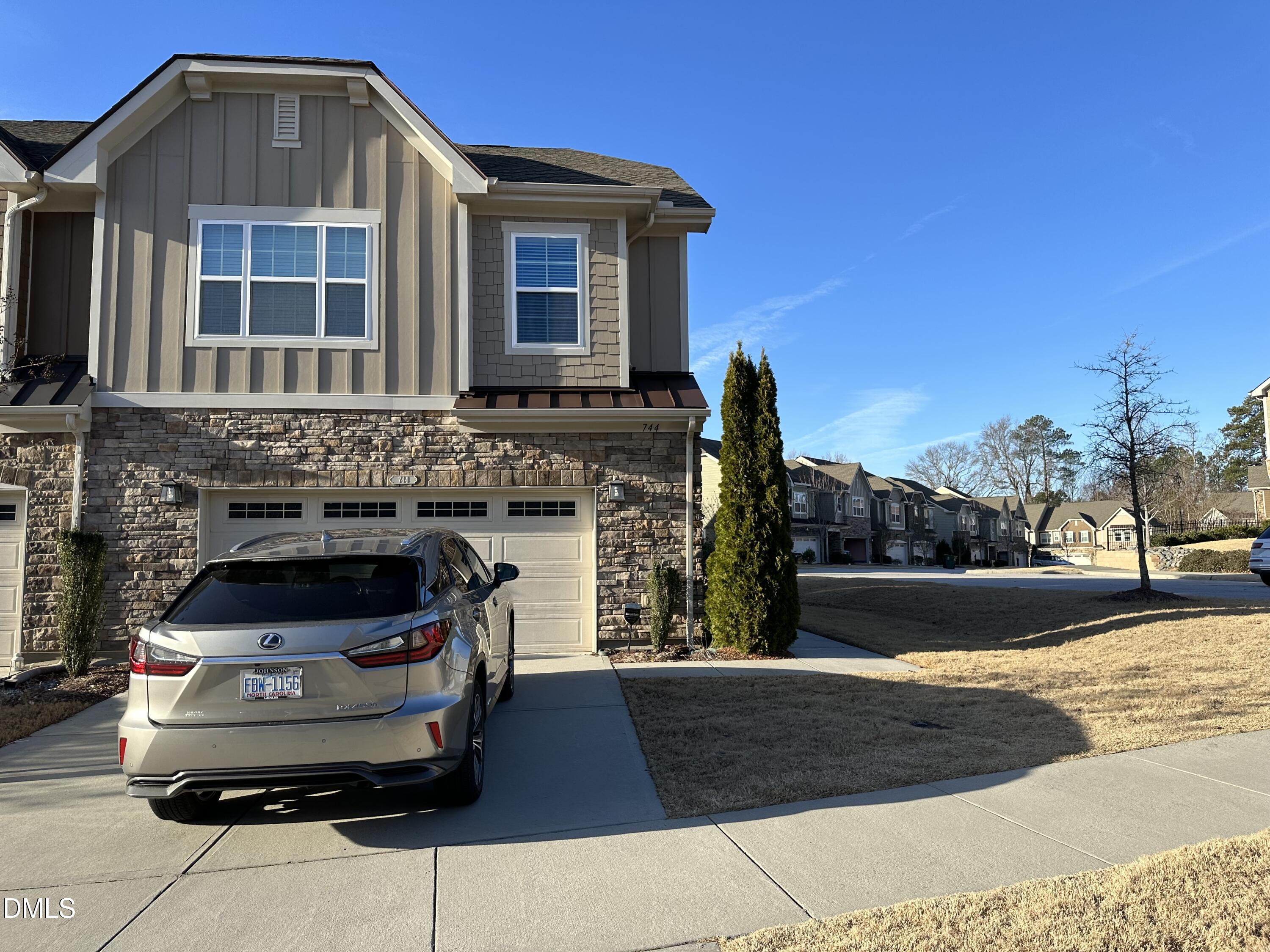 744 McRae Road Cary, NC 27519 - Photo 1 of 5 a front view of a house with a yard