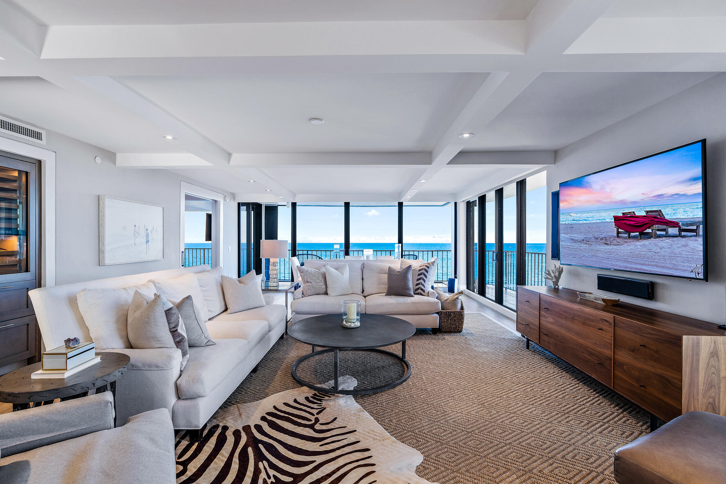 100 South Beach Road, Unit 604 Tequesta, FL 33469 - Photo 13 of 58 a living room with furniture and a flat screen tv