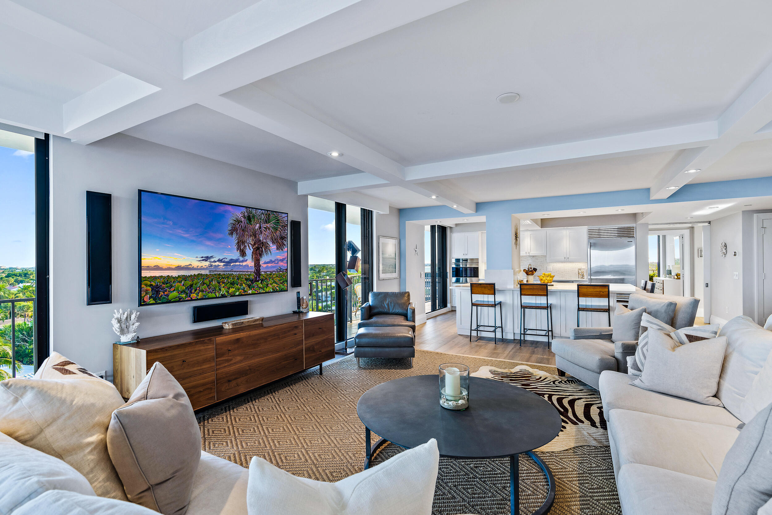 100 South Beach Road, Unit 604 Tequesta, FL 33469 - Photo 17 of 58 a living room with furniture and a flat screen tv