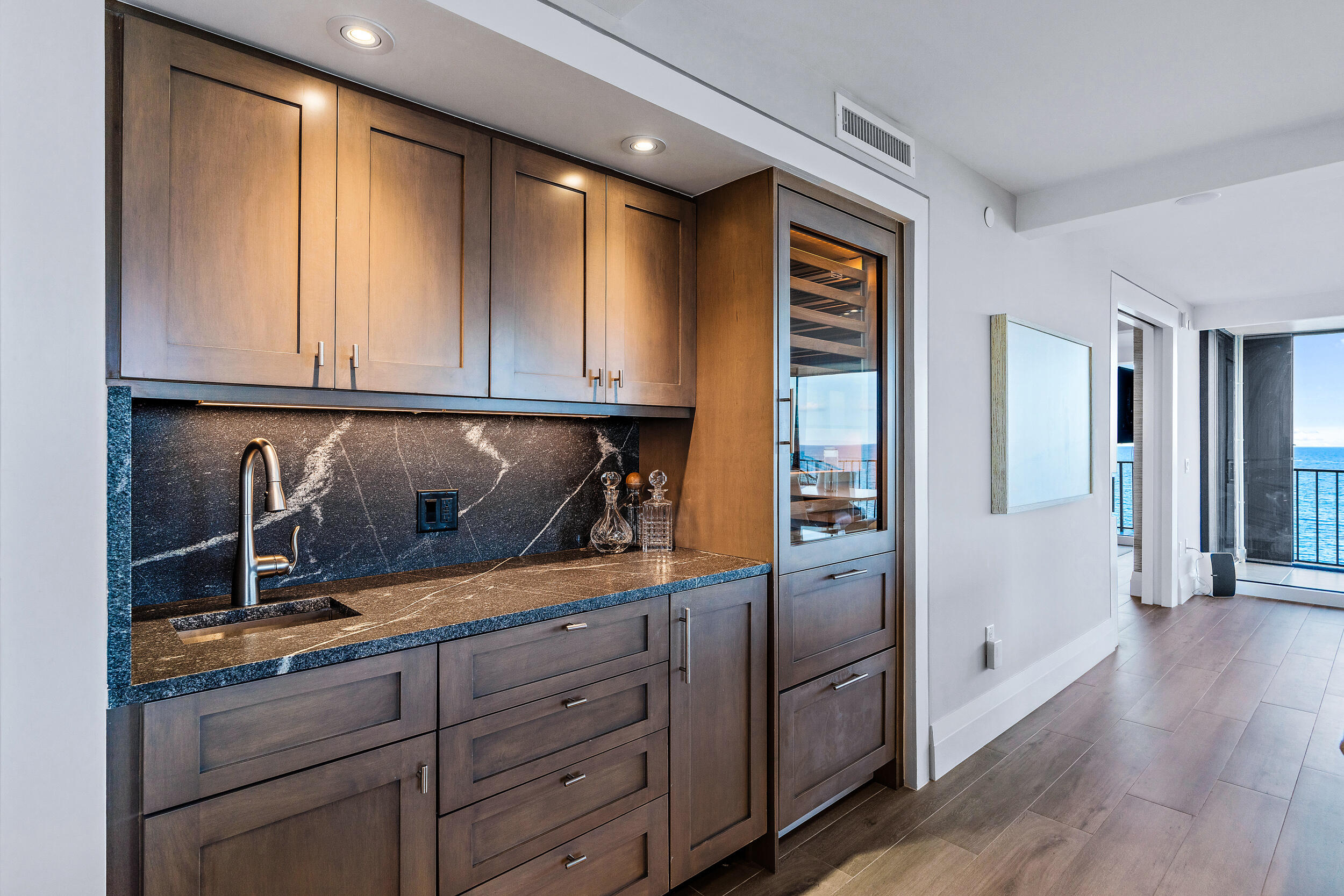 100 South Beach Road, Unit 604 Tequesta, FL 33469 - Photo 19 of 58 a kitchen with granite countertop cabinets and window