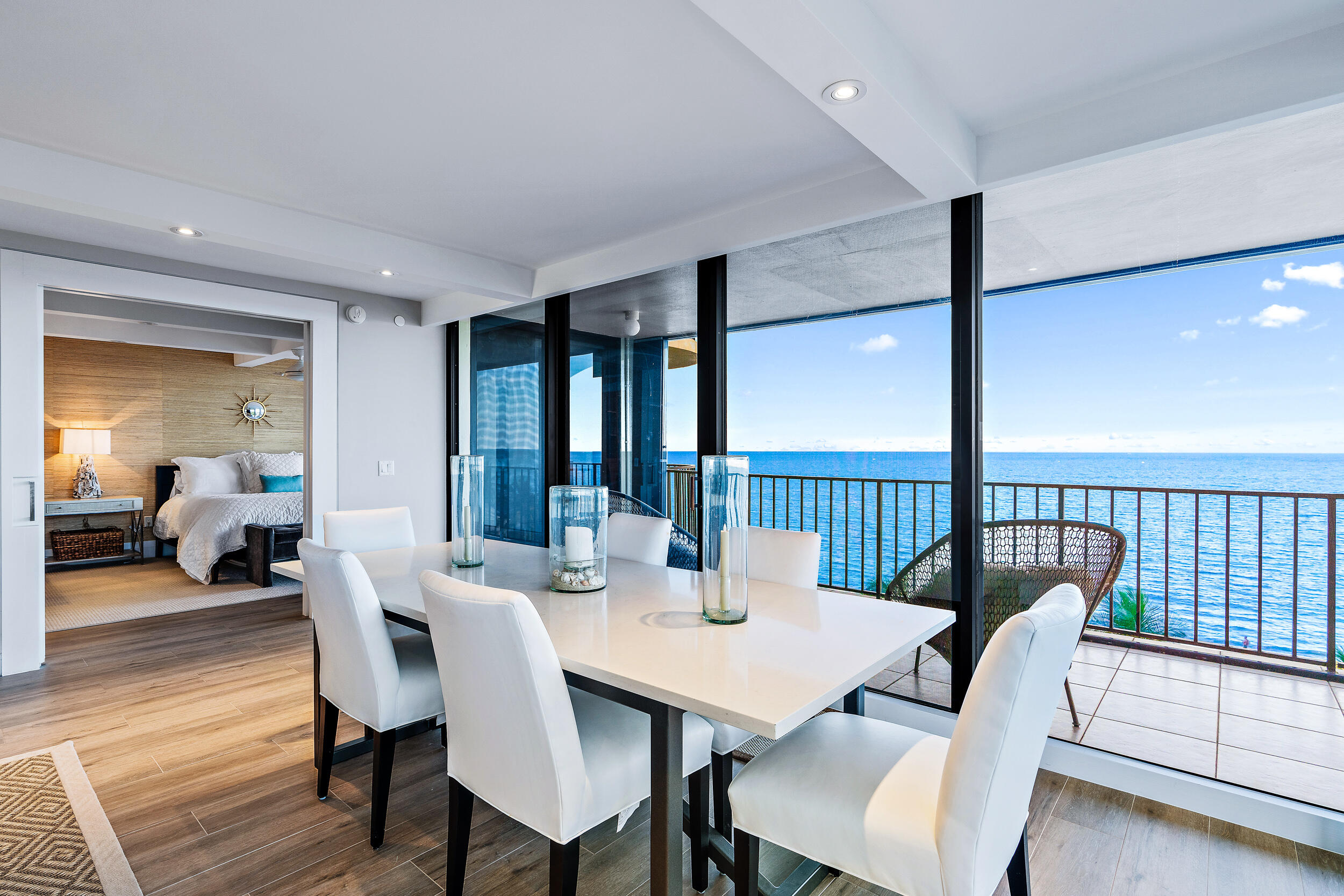 100 South Beach Road, Unit 604 Tequesta, FL 33469 - Photo 20 of 58 a view of a dining room with furniture window and wooden floor