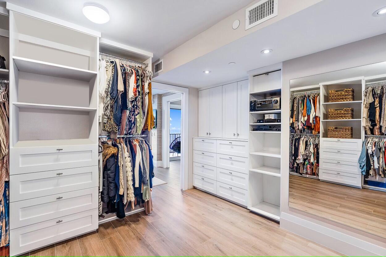 100 South Beach Road, Unit 604 Tequesta, FL 33469 - Photo 26 of 58 a view of walk in closet with clothes and shoes