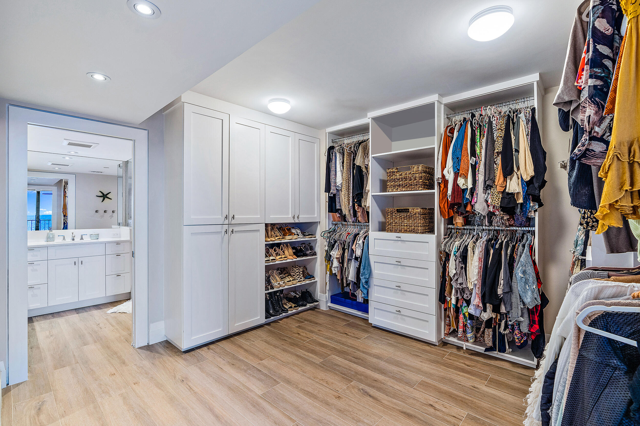 100 South Beach Road, Unit 604 Tequesta, FL 33469 - Photo 27 of 58 a view of walk in closet with clothes and shoes