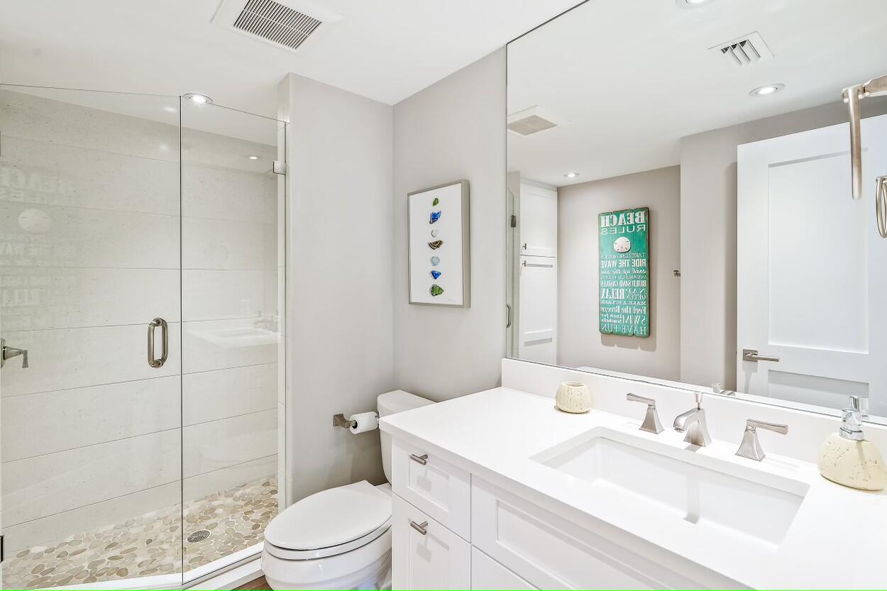 100 South Beach Road, Unit 604 Tequesta, FL 33469 - Photo 30 of 58 a bathroom with a sink a toilet and shower