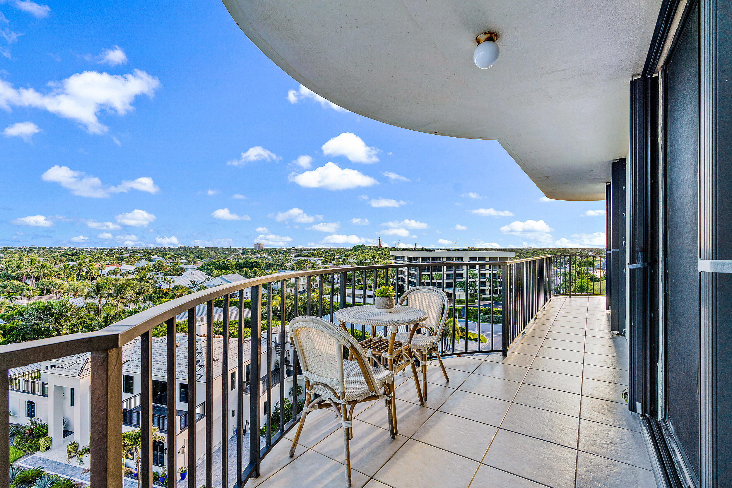 100 South Beach Road, Unit 604 Tequesta, FL 33469 - Photo 36 of 58 a view of a balcony with chairs