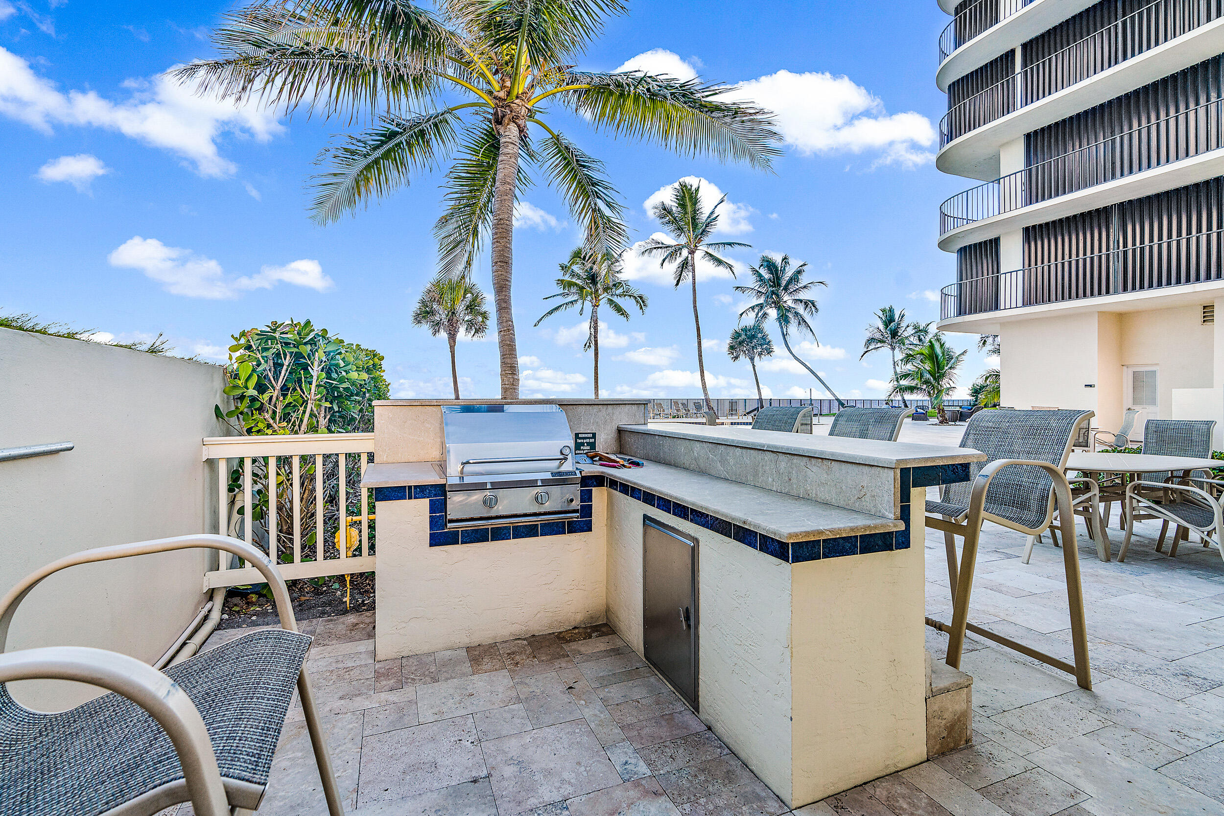 100 South Beach Road, Unit 604 Tequesta, FL 33469 - Photo 44 of 58 a view of a chairs and table in patio