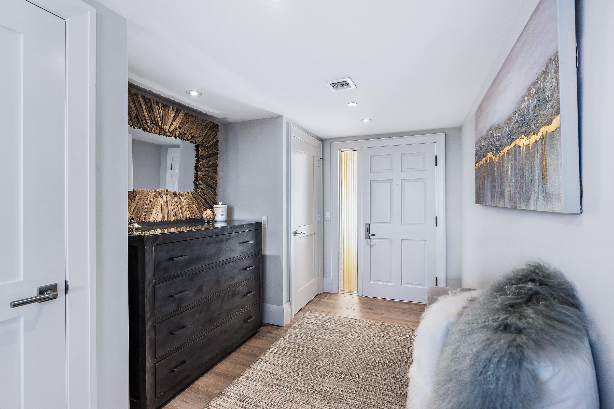 100 South Beach Road, Unit 604 Tequesta, FL 33469 - Photo 6 of 58 a room with a bed and a mirror