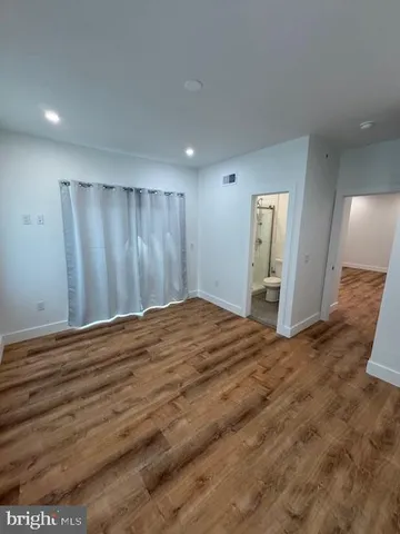 a bathroom with a toilet sink and a mirror