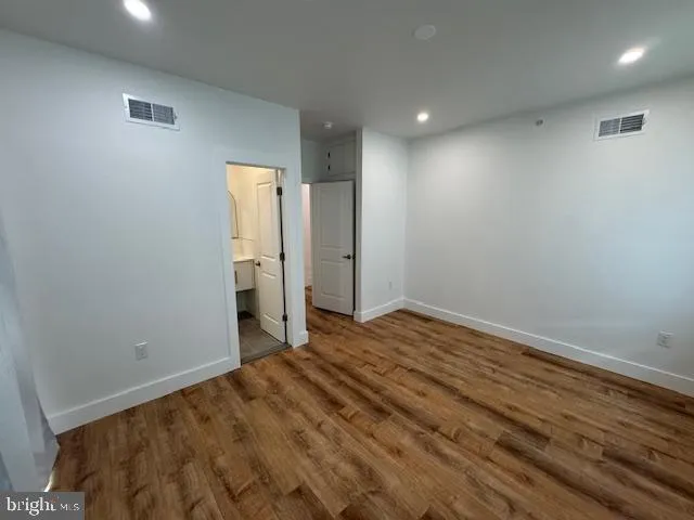 a bathroom with a toilet sink and shower