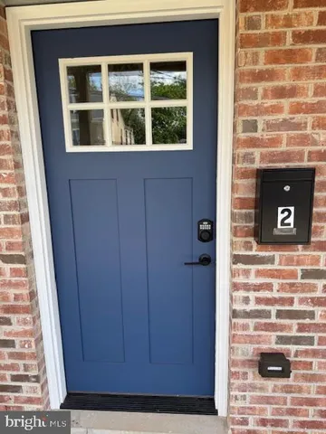 a view of entryway with wooden floor