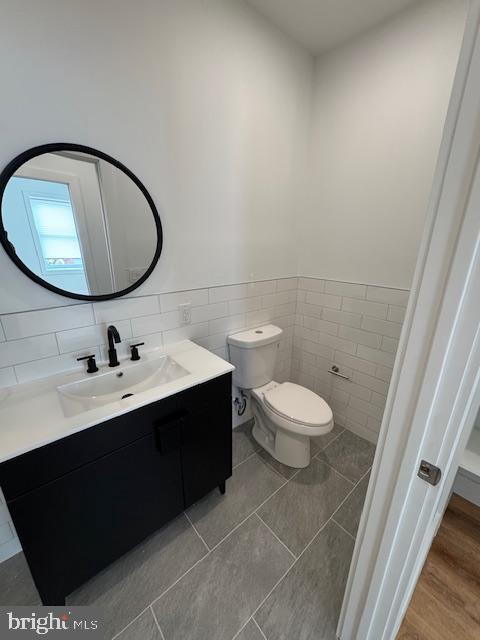 442 West Queen Lane, Unit 2 Philadelphia, PA 19144 - Photo 30 of 31 a bathroom with a toilet sink a mirror and vanity
