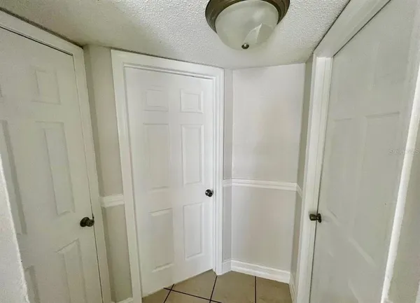 a bathroom with a granite countertop sink and shower