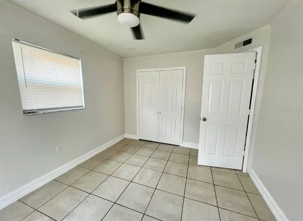 a view of an empty room and window