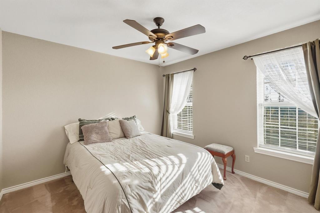 2296 Old Decatur Road Decatur, TX 76234 - Photo 27 of 39 Bedroom with a ceiling fan and light colored carpet