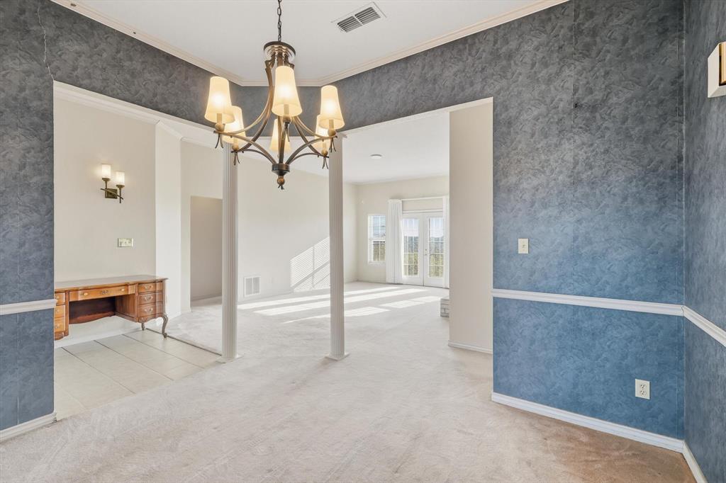 2296 Old Decatur Road Decatur, TX 76234 - Photo 6 of 39 Unfurnished dining area featuring light carpet, wallpapered walls, ornamental molding, a chandelier, and a desk