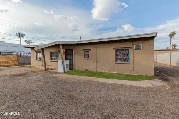 a view of a car park in front of house
