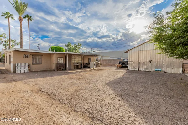 a view of a white house with a outdoor space