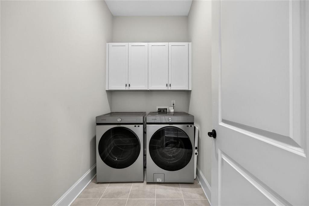 109 Village Green Avenue Woodstock, GA 30189 - Photo 29 of 37 a utility room with dryer and washer