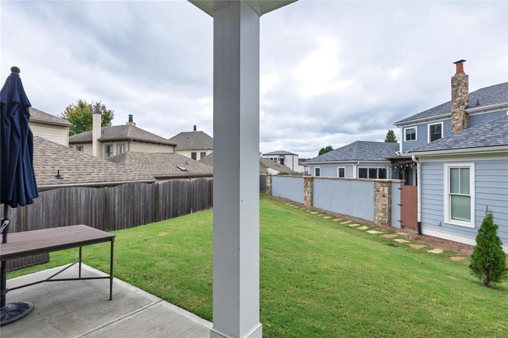 109 Village Green Avenue Woodstock, GA 30189 - Photo 32 of 37 a view of a deck in front of house with a yard