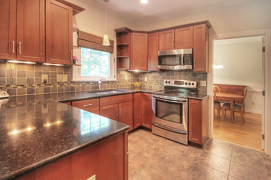 107 Arlington Ridge Cary, NC 27513 - Photo 2 of 25 Kitchen with Cherry Cabinets