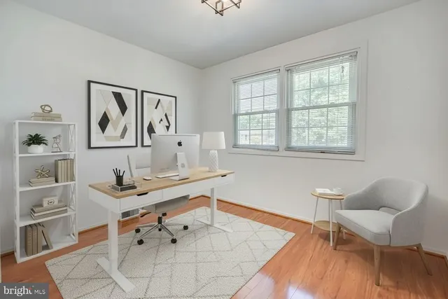 a workspace with furniture and window