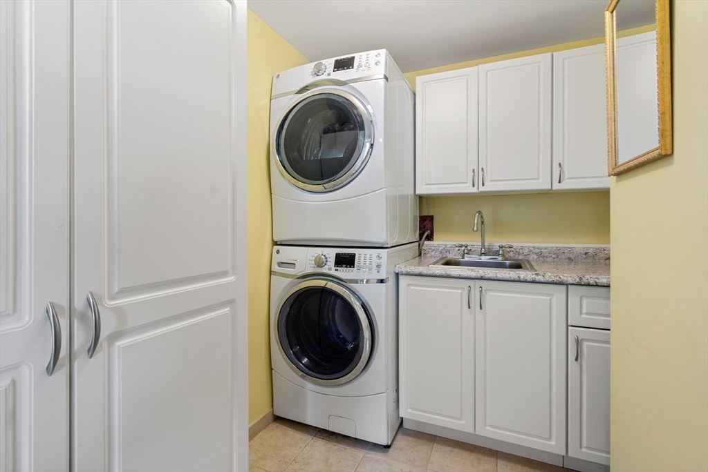 79 Florence Street, Unit 508S Newton, MA 02467 - Photo 13 of 20 a utility room with sink dryer and washer