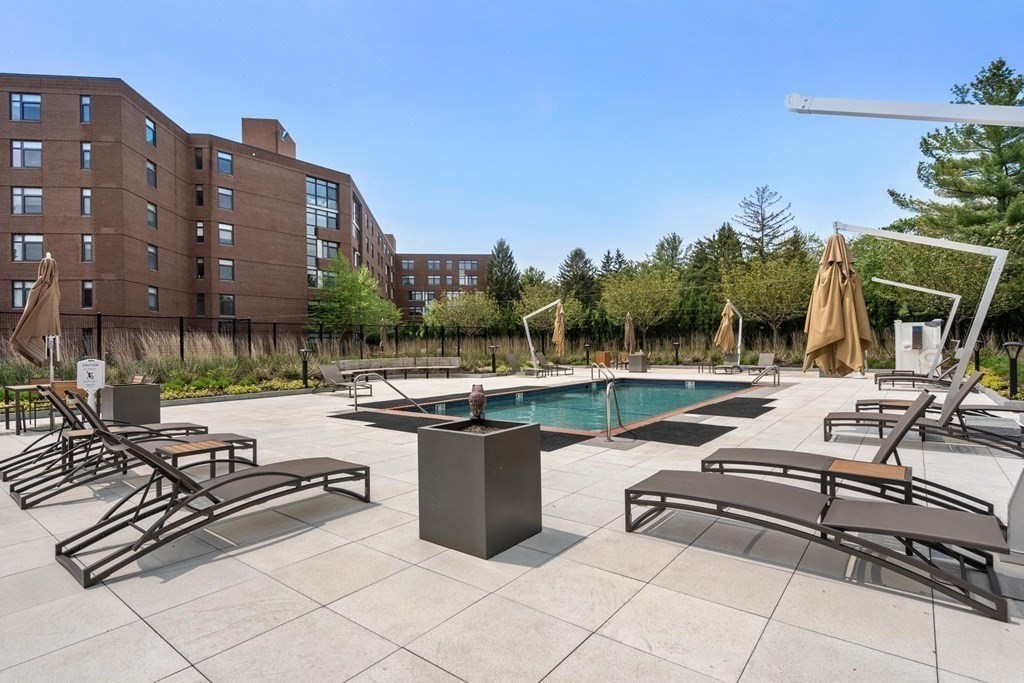 79 Florence Street, Unit 508S Newton, MA 02467 - Photo 17 of 20 a view of a patio with swimming pool and sitting area