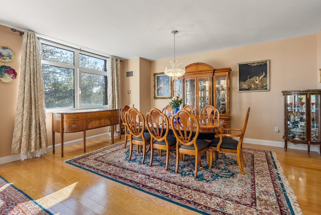 79 Florence Street, Unit 508S Newton, MA 02467 - Photo 3 of 20 a dining room with furniture window and wooden floor