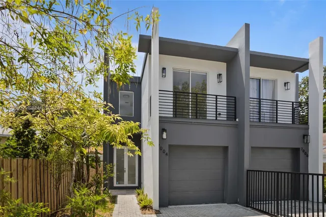 a view of a house with a tree