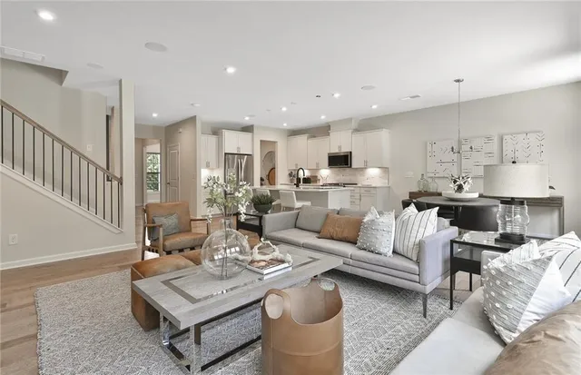 a bathroom with a sink a toilet a mirror and shower