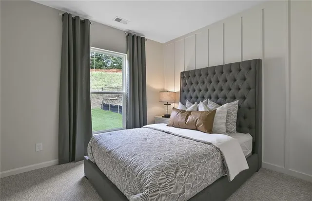 a living room with furniture potted plant and a window
